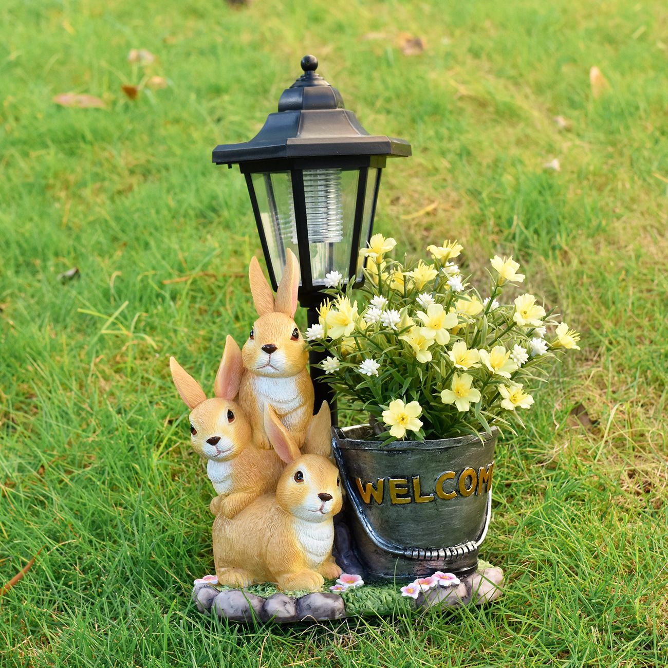 Solar Simulation Rabbit Ornament, charges by day and lights up automatically at night, three rabbits cluster around a street lamp with "WELCOME" bucket, warmly decorates courtyard and balcony, eco-friendly and healing./Rabbit's Kin