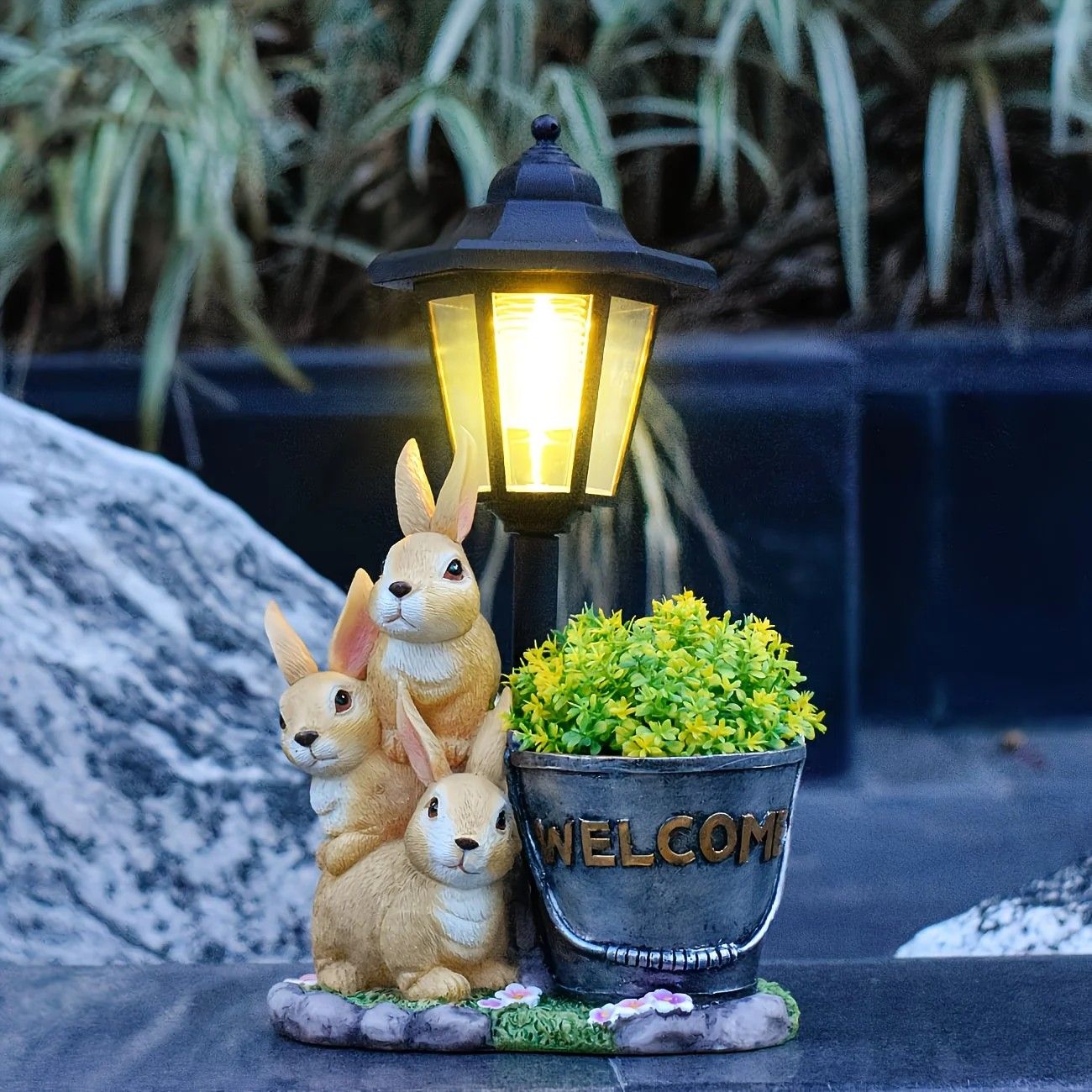 Solar Simulation Rabbit Ornament, charges by day and lights up automatically at night, three rabbits cluster around a street lamp with "WELCOME" bucket, warmly decorates courtyard and balcony, eco-friendly and healing./Resin flowerpot rabbit